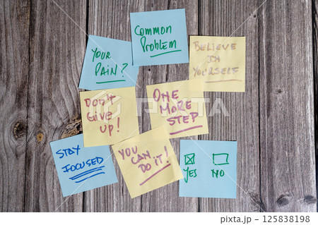 Motivational sticky notes with positive affirmations on wooden background Motivational sticky notes with positive affirmations on wooden background 125838198