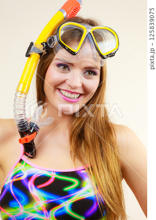 Woman with snorkeling mask having fun Woman with snorkeling mask having fun 125839075