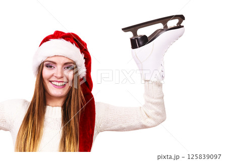 woman santa claus with ice skates woman santa claus with ice skates 125839097