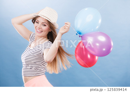 Woman summer joyful girl with colorful balloons 125839414