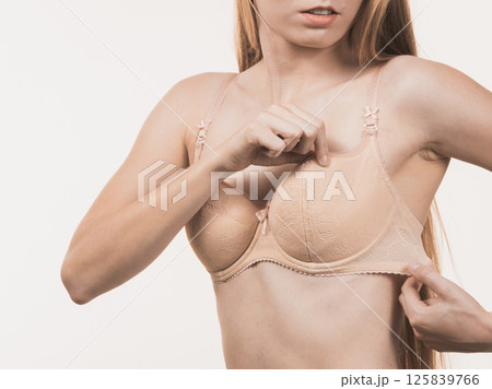 Female wearing too big bra, wrong size Female wearing too big bra, wrong size 125839766