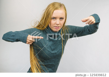 Female pointing with finger Female pointing with finger 125839812