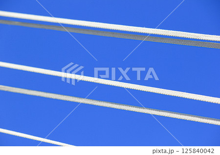 The ropes are brightly colored against the blue sky. The ropes are brightly colored against the blue sky. 125840042