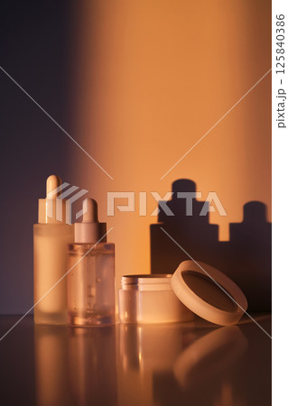 A set of cosmetics in the rays of the setting sun. A set of cosmetics in the rays of the setting sun. 125840386