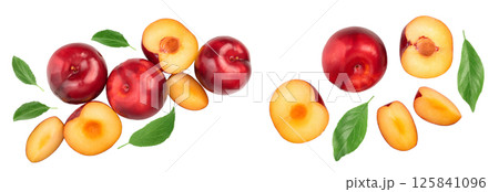 fresh red plum and half with leaves isolated on white background. Top view. Flat lay fresh red plum and half with leaves isolated on white background. Top view. Flat lay 125841096