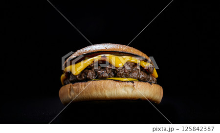 Great burger on a dark isolated phone 125842387