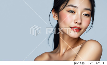 Portrait of beautiful asian woman on isolated grey background Portrait of beautiful asian woman on isolated grey background 125842401