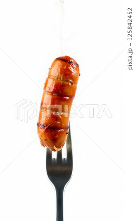 Juicy fried sausage on a white background 125842452