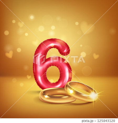Red number 6 and gold wedding rings. 125843120