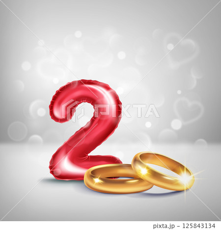 Red number 2 and gold wedding rings. 125843134