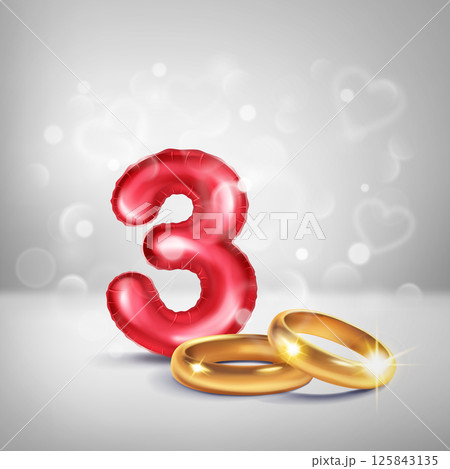 Red number 3 and gold wedding rings. 125843135