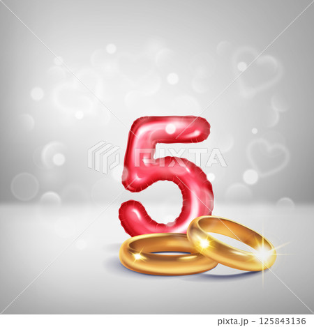 Red number 5 and gold wedding rings. Red number 5 and gold wedding rings. 125843136
