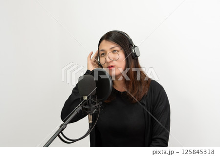 Woman (LGBTQ) singer sing a song with microphone 125845318