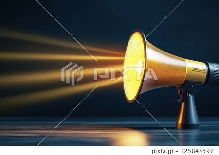 Yellow Megaphone with Bright Light Rays on Dark Background in Modern Style 125845397