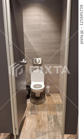 Clean public restroom stall with modern toilet and wooden floor 125845739