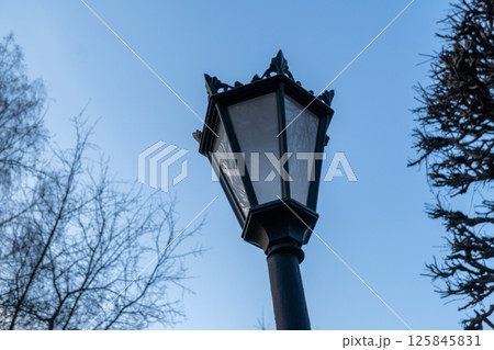 Vintage street lamp against clear blue sky in winter 125845831