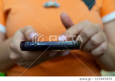 Caucasian female adult using smartphone with painted nails Caucasian female adult using smartphone with painted nails 125845870