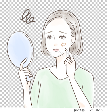 A woman worries about spots while looking at a hand mirror 125846486