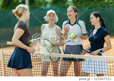 Tennis match female participants chat after game 125847721