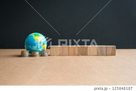 Globe with coins and seven square blocks Globe with coins and seven square blocks 125848187