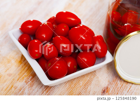 Marinated tomatoes on white plate Marinated tomatoes on white plate 125848190