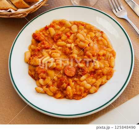 Delicious stewed beans with chorizo sausage pieces Delicious stewed beans with chorizo sausage pieces 125848490