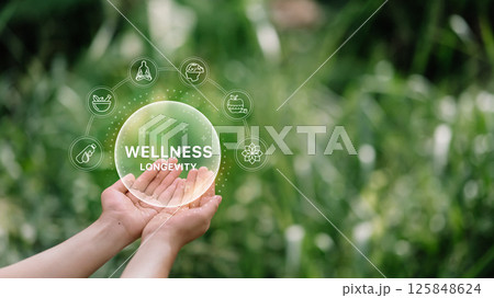 Virtual wellness elements hovering over hands in nature. Holistic health concept 125848624