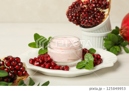 Self care and skincare products concept - pomegranate cosmetics Self care and skincare products concept - pomegranate cosmetics 125849953