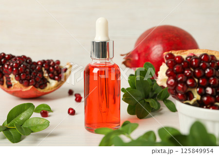 Self care and skincare products concept - pomegranate cosmetics Self care and skincare products concept - pomegranate cosmetics 125849954