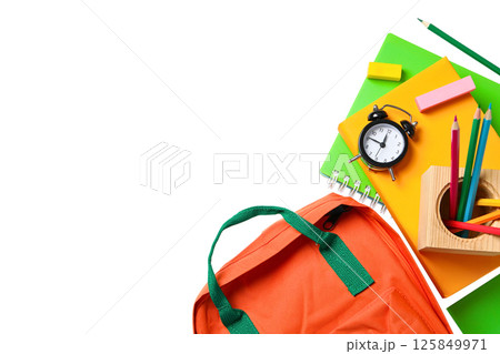 Backpack and school supplies arranged for learning activities, isolated on white 125849971