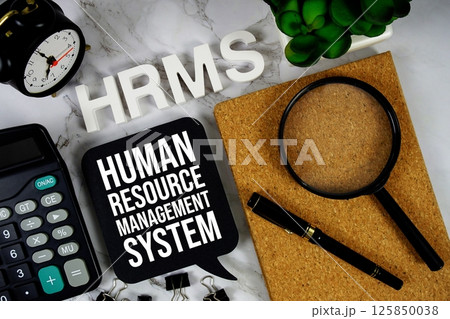 HRMS - Human Resource Management System acronym with calculator, alarm clock and magnifying glass, business concept background HRMS - Human Resource Management System acronym with calculator, alarm clock and magnifying glass, business concept background 125850038