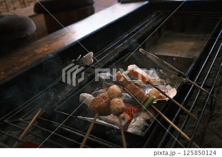 set of Robatayaki, a japanese cuisine, similar to barbecue, in which items of meat and seafood are cooked at varying speeds over hot charcoal. set of Robatayaki, a japanese cuisine, similar to barbecue, in which items of meat and seafood are cooked at varying speeds over hot charcoal. 125850124