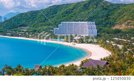 Luxury seaside hotel at sea with sandy beach in Hon Tre island in Nha Trang in Vietnam, aerial view. A resort in Asia 125850830