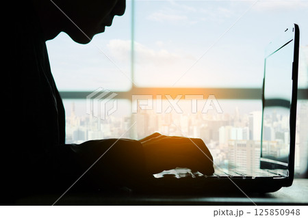 woman sitting down, his face unsettled. At the computer desk she has headaches and stress. Cause of hard work and insufficient rest. woman sitting down, his face unsettled. At the computer desk she has headaches and stress. Cause of hard work and insufficient rest. 125850948