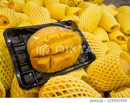 Organic Yellow ripe mango in package at supermarket. Organic Yellow ripe mango in package at supermarket. 125852450