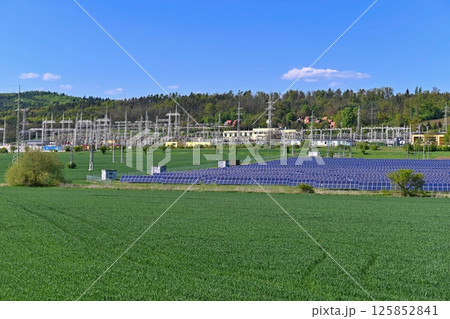 Electric power poles. Power plant - current distribution station. Concept for industry and technology with electricity. 125852841