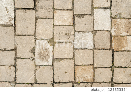 Antique ancient stone wall masonry texture background. Old wall made of beige stone blocks Antique ancient stone wall masonry texture background. Old wall made of beige stone blocks 125853534