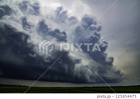 RAIN DAY. Hurricane season. World Meteorological Day. Global Climate Change awareness. Stormy Supercell cumulonimbus clouds forming before thunderstorm on dark sky. RAIN DAY. Hurricane season. World Meteorological Day. Global Climate Change awareness. Stormy Supercell cumulonimbus clouds forming before thunderstorm on dark sky. 125854475