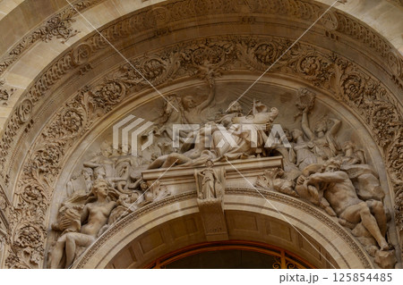Intricate Stone Relief on Historic Archway. 125854485