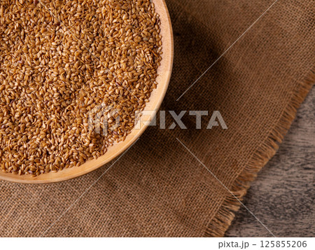 Organic golden flaxseed, linseed grains. Superfood high in fiber. Organic golden flaxseed, linseed grains. Superfood high in fiber. 125855206
