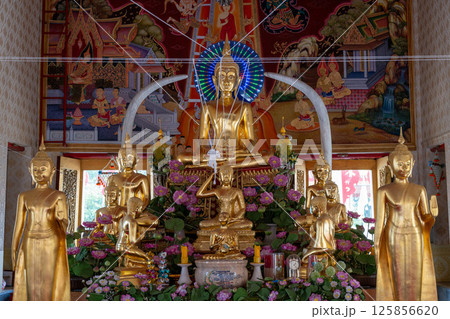 Nonthaburi, Thailand, March 15, 2025, Inside Wat Chimphli Sutthawat showcasing ornate decorations and golden statues in a serene atmosphere 125856620