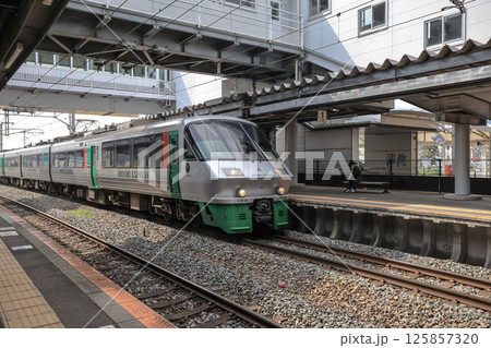 March 26 2025 Modern Train at Station Platform Beneath Artistic Overpass Structure, Japan March 26 2025 Modern Train at Station Platform Beneath Artistic Overpass Structure, Japan 125857320
