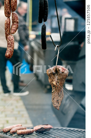 Cured Meats Hanging at Outdoor Market Cured Meats Hanging at Outdoor Market 125857506