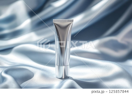 Package beauty cosmetic tube white, silver color. Flowers, silk mockup template Package beauty cosmetic tube white, silver color. Flowers, silk mockup template 125857844