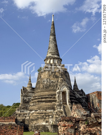 Majestic spiritual Wat Chaiwatthanaram Ayutthaya historic temple, ancient beautiful brick towers glowing under a golden sunset. Spiritual heritage, culture and architectural features. 125857909
