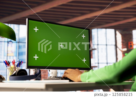 Man enjoying leisure time in apartment, using isolated screen PC screen to text friends. Person talking with mates on social network internet website using mockup computer display, close up 125858215