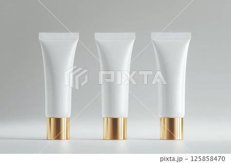 Three beauty package cosmetic tubes of white, cream, gold color mockup template 125858470