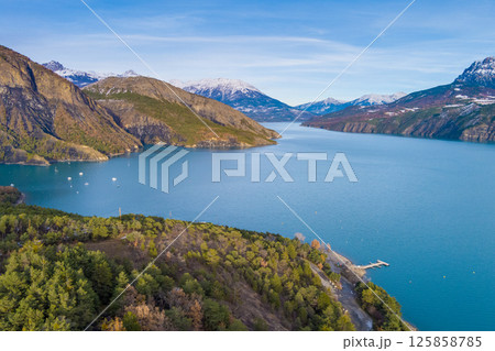 Mountain lake in autumn Aerial view. Serre-Poncon mountain lake in winter. Hautes Alpes, France Mountain lake in autumn Aerial view. Serre-Poncon mountain lake in winter. Hautes Alpes, France 125858785