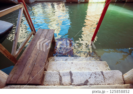 Stairway to water, pier for gondola and boat 125858852