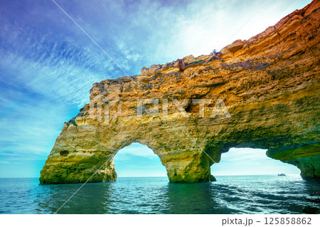 Coastal rocky seascape. View of Praia da Marinha beach and Benagil in Algarve region in the Atlantic Ocean. Portugal, Europe. Rock Elephant drinks water 125858862